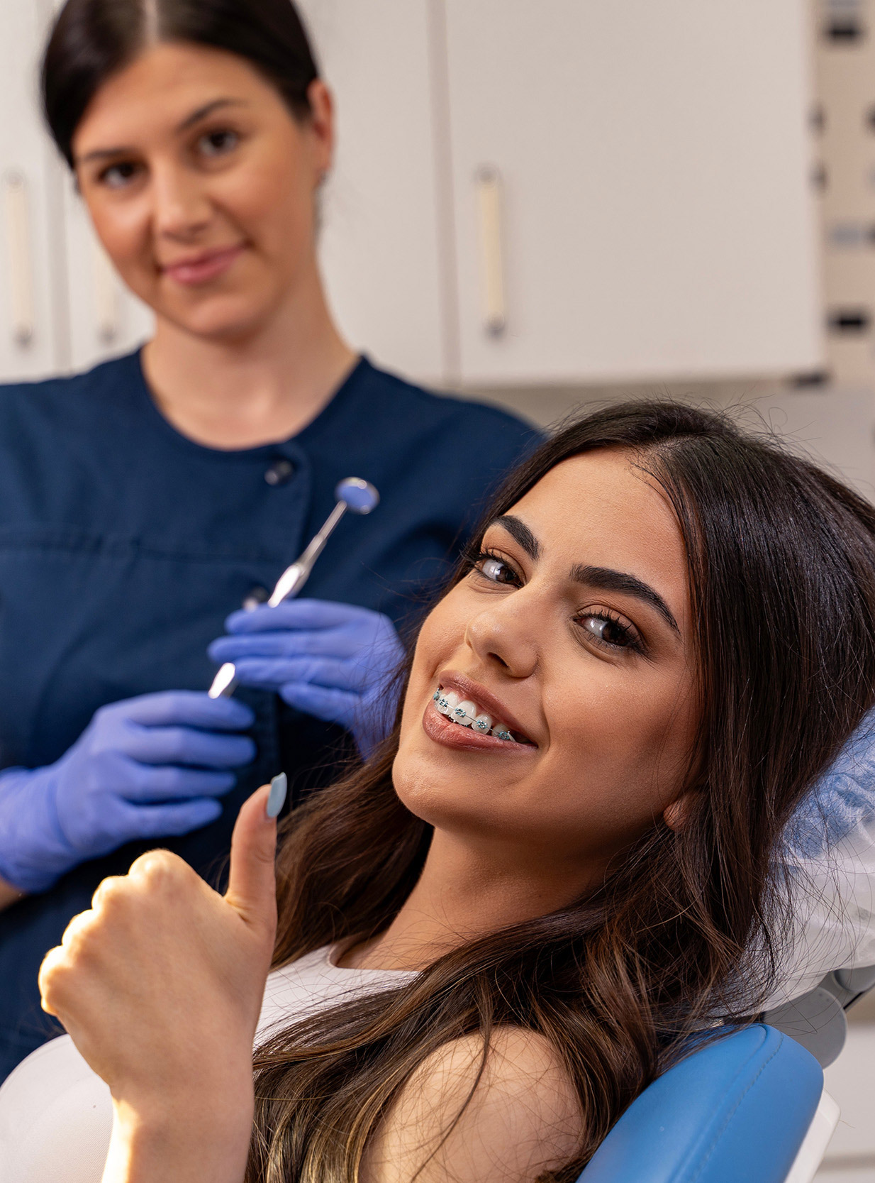 A dentist at quiet focus inside a well-run practice