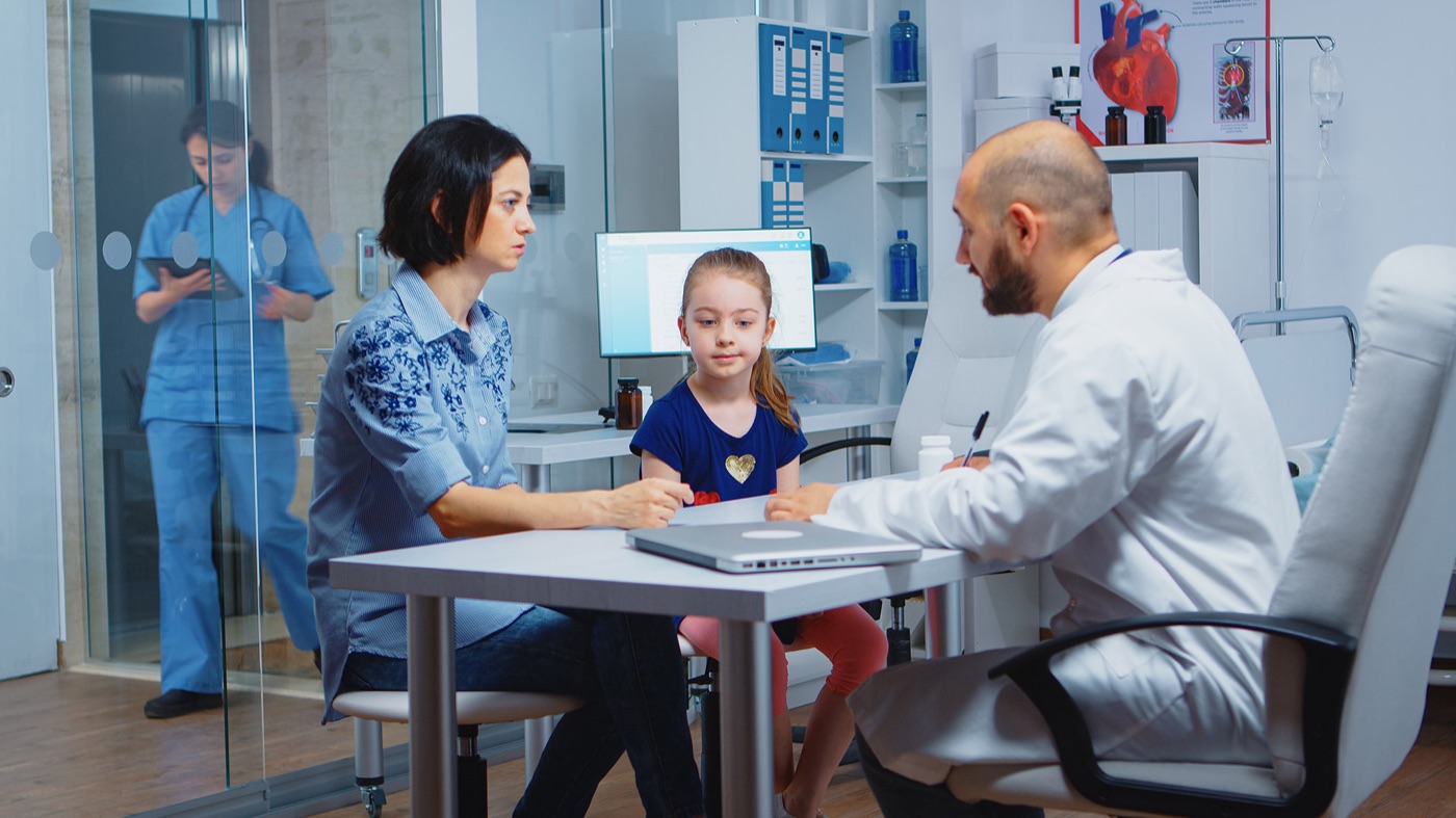 A private healthcare clinician with a patient