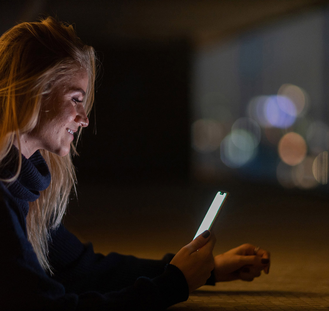 A patient lit by a phone screen at night, the moment a serious enquiry sits unanswered