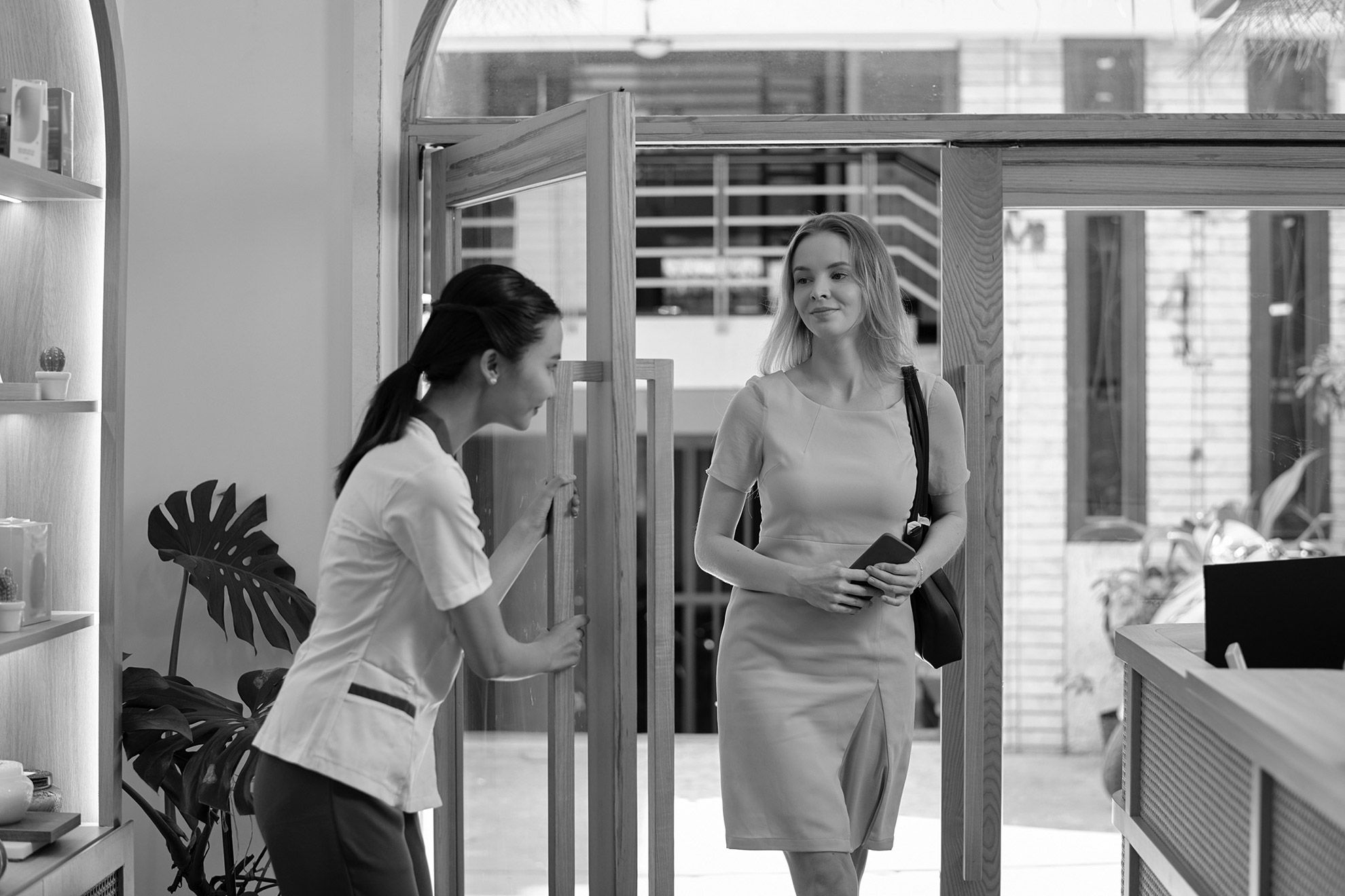 A patient arriving at a premium clinic, the moment a warm handoff has been prepared in advance